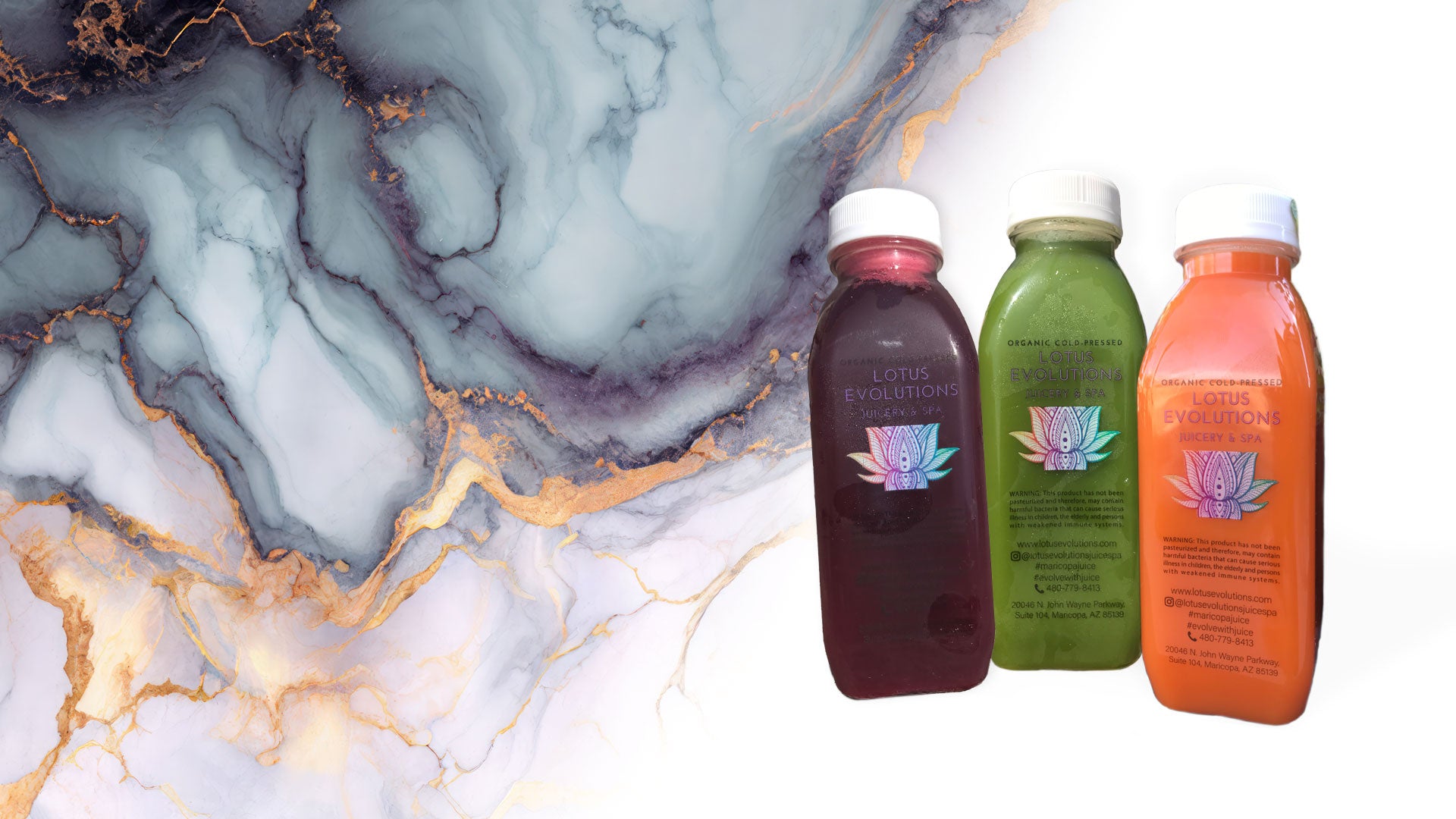 a photo of juices with a marble background behind them